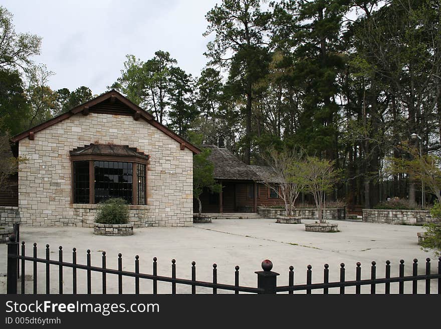 Fenced Lodge With Trees