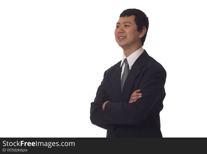 Young asian businessman smiling looking to the side, isolated