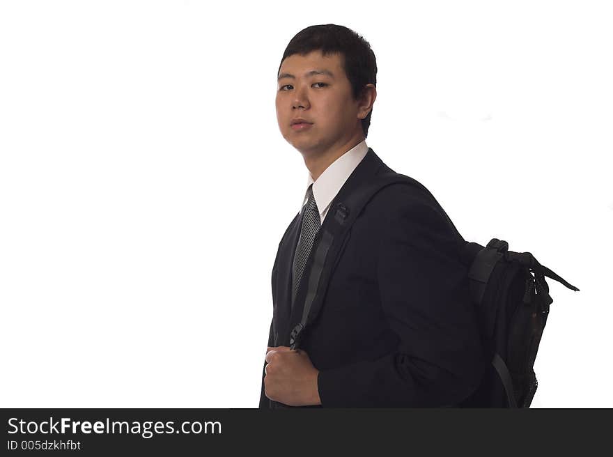 Young asian businessman wearing a backpack, isolated. Young asian businessman wearing a backpack, isolated