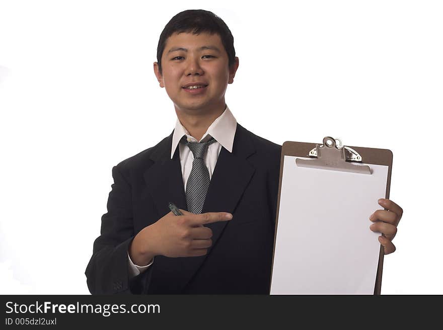 Asian businessman pointing to blank clipboard and smiling. Asian businessman pointing to blank clipboard and smiling