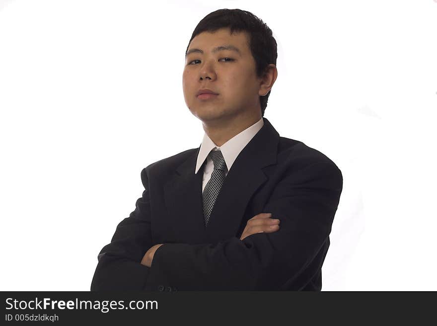 Young asian businessman looking at camera with serious face. Young asian businessman looking at camera with serious face