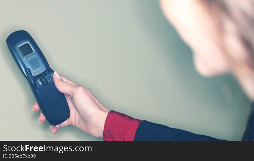 Business woman with black suit taking picture of herself with cell phone camera. Business woman with black suit taking picture of herself with cell phone camera