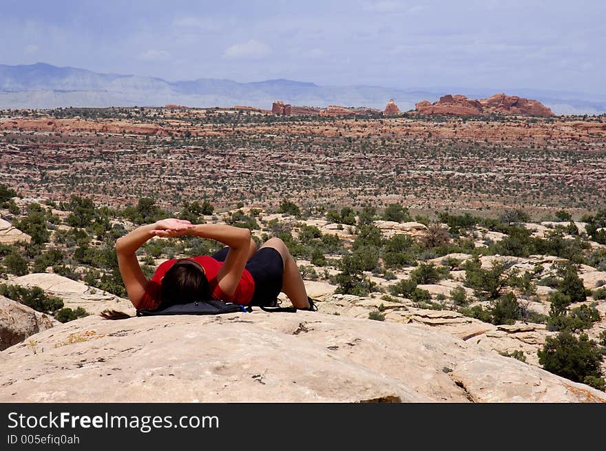 Woman resting during a hike in Arches National Park, UT. Woman resting during a hike in Arches National Park, UT