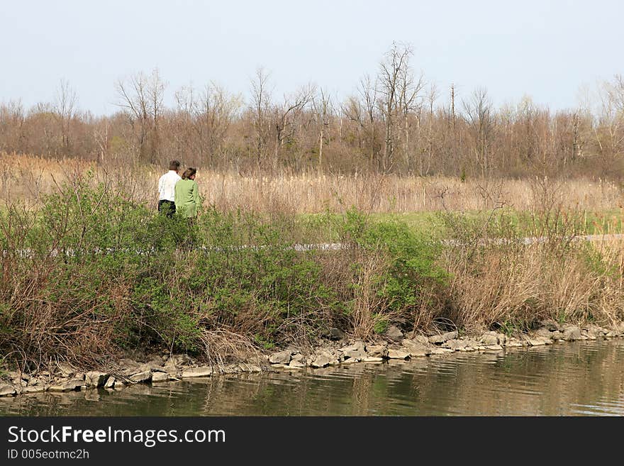 Couple walking by river