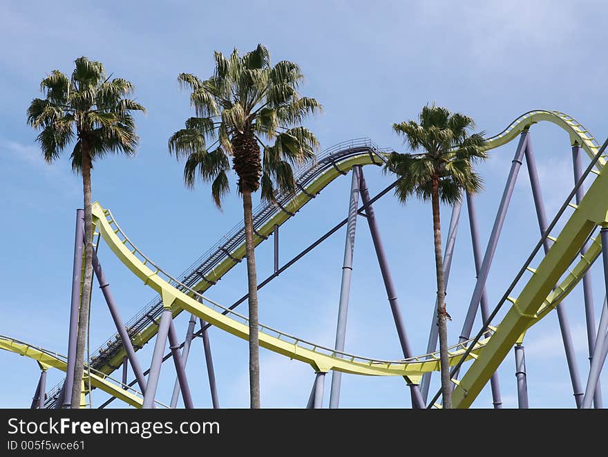 Roller coaster and palm trees