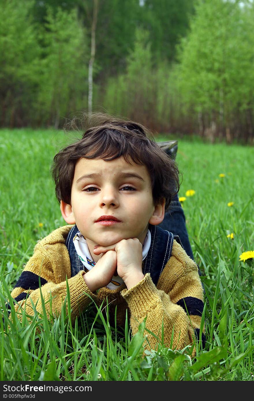 Spring day. Game on a meadow with dandelions. Spring day. Game on a meadow with dandelions.