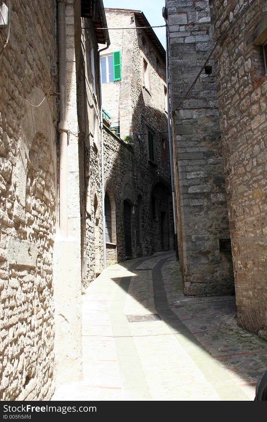 A old alley in the old part of Todi, Italy. A old alley in the old part of Todi, Italy.