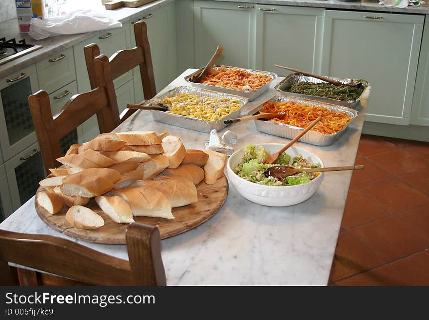 A set table with different dishes if pasta. A set table with different dishes if pasta