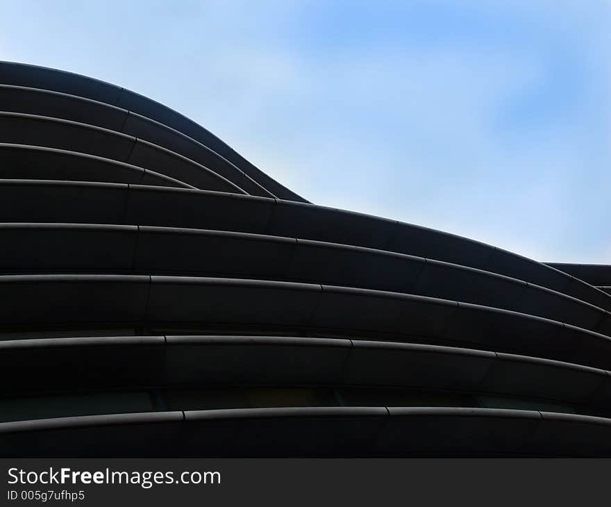 Front of an office building with blue sky behind