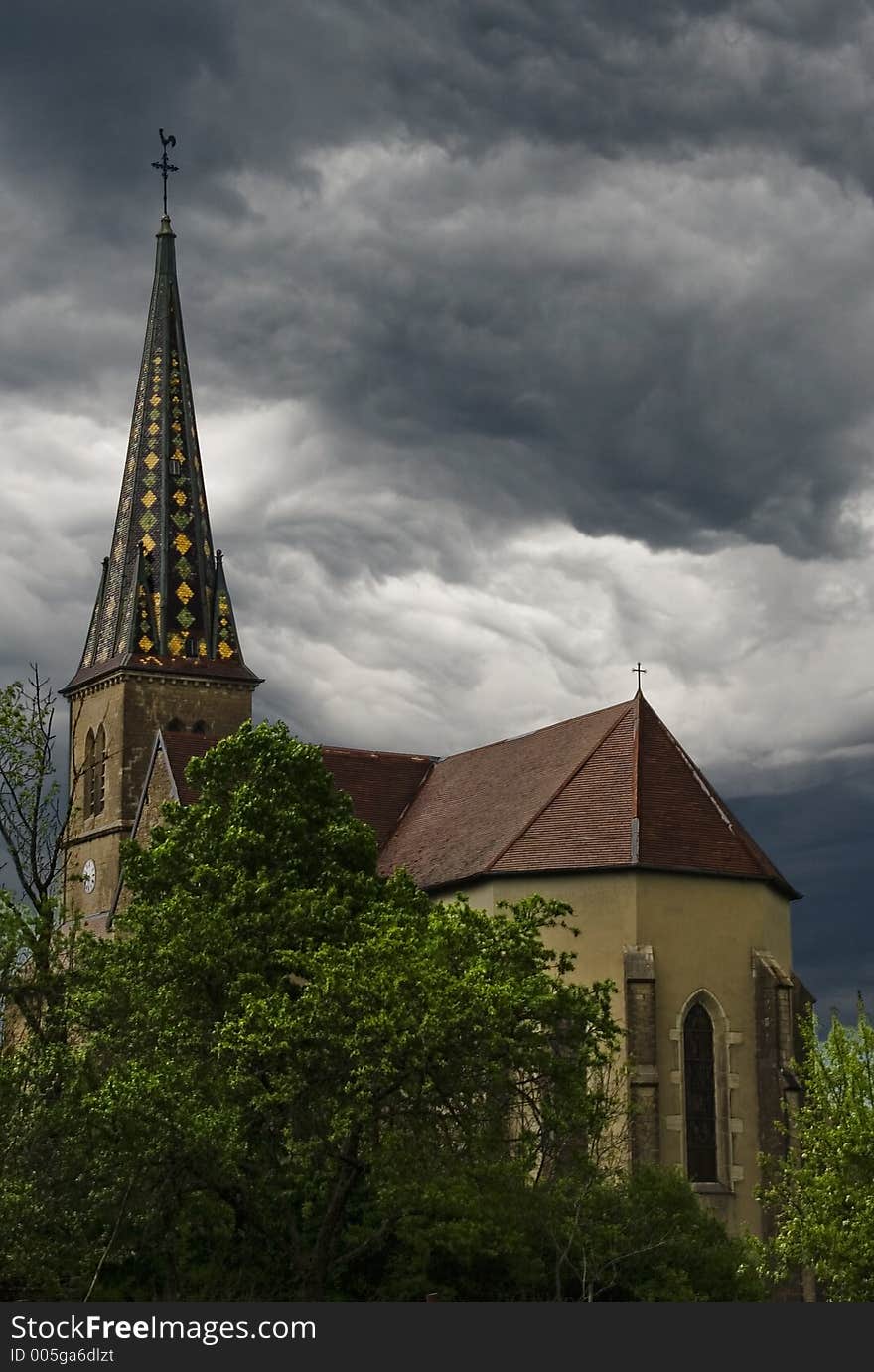 Storm clouds forming over a beautiful church. Vevy, France. Storm clouds forming over a beautiful church. Vevy, France.