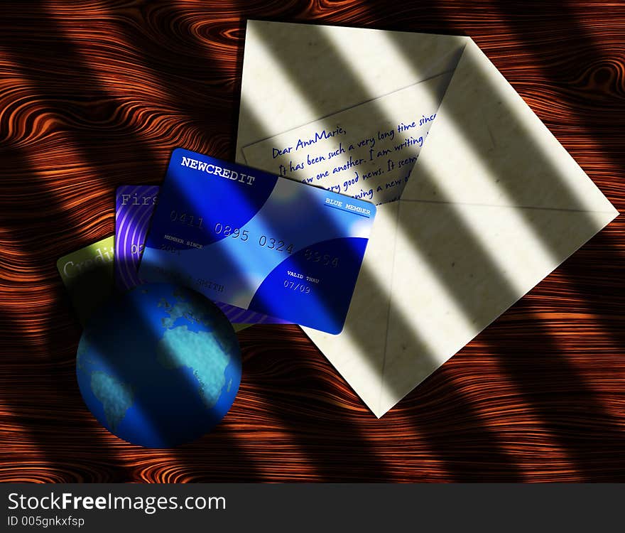 A globe of earth, a open letter and credit cards on a wooden desk. A globe of earth, a open letter and credit cards on a wooden desk