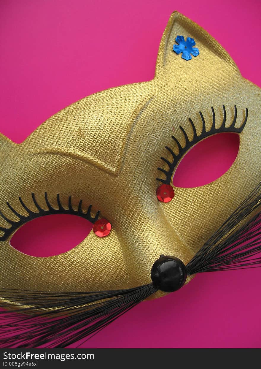 A golden cat mask. A golden cat mask.