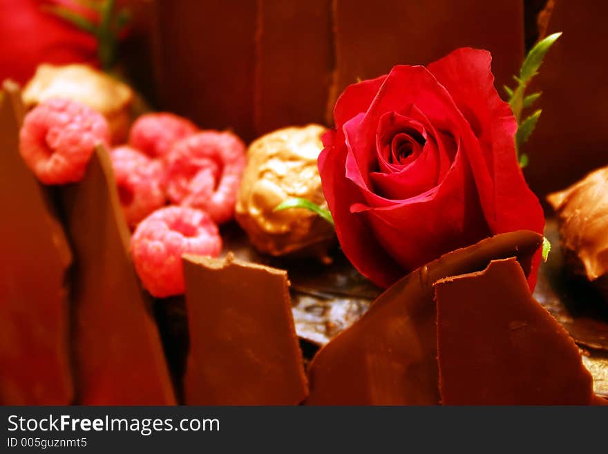 Rose decorated berry chocolate cake