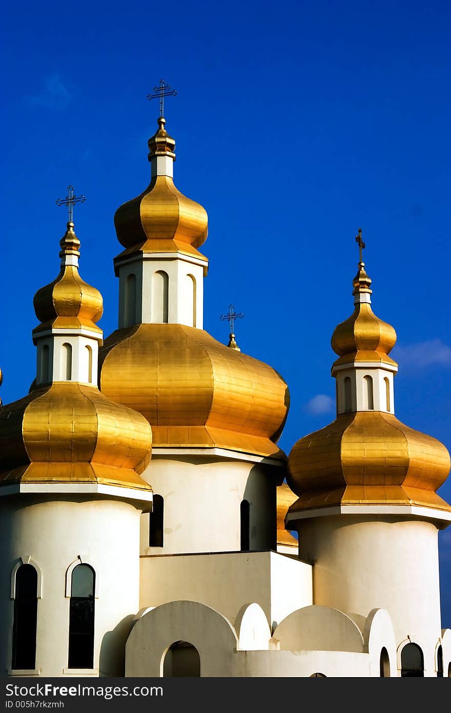 Golden Ukrainian Church roofs with deep blue sky. Golden Ukrainian Church roofs with deep blue sky