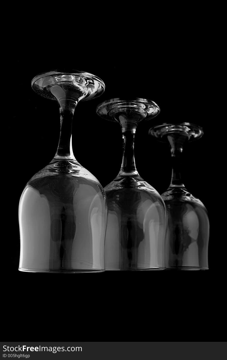 Reverse wine glasses on black background. Reverse wine glasses on black background