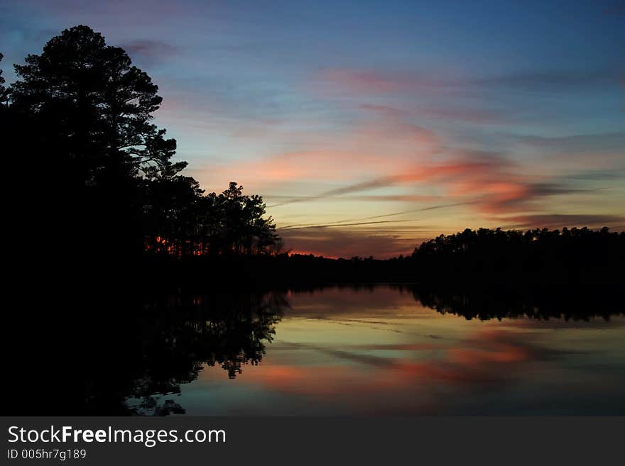 Reflected sunset with trees. Reflected sunset with trees