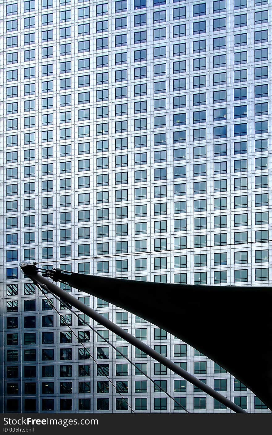 Business building wall with part of sail ship in front