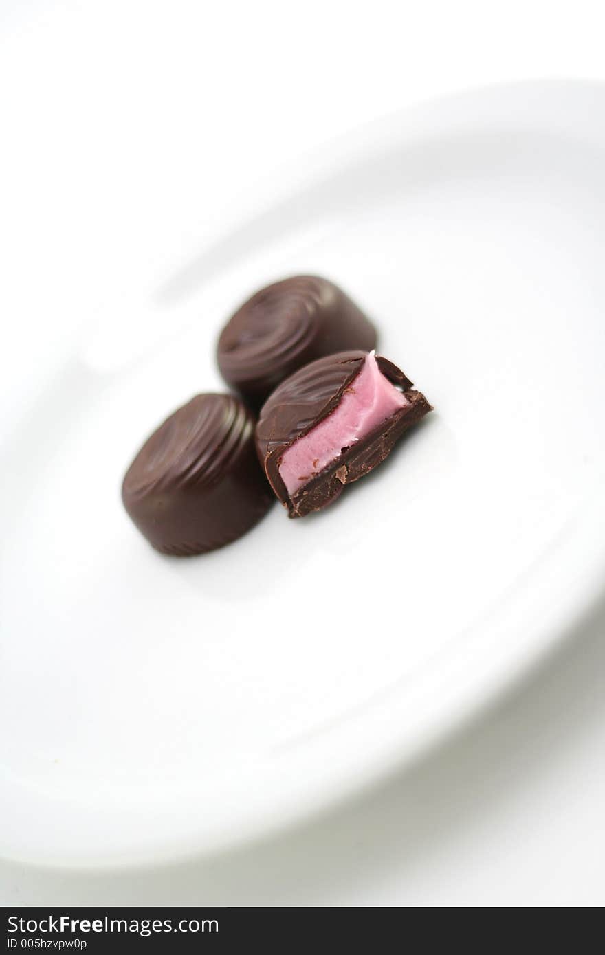 Chocolate candy on a white background with shallow DOF. Chocolate candy on a white background with shallow DOF