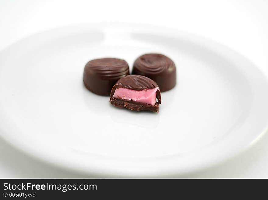 Half eaten chocolate on a plate