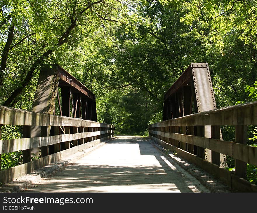 Bridge through a nature trail. Bridge through a nature trail