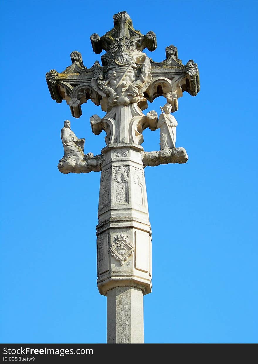 Stone cross over a blue sky