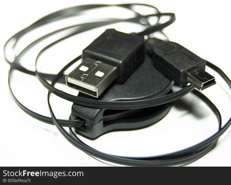 Black USB Cable over white background
Shallow Depth of field