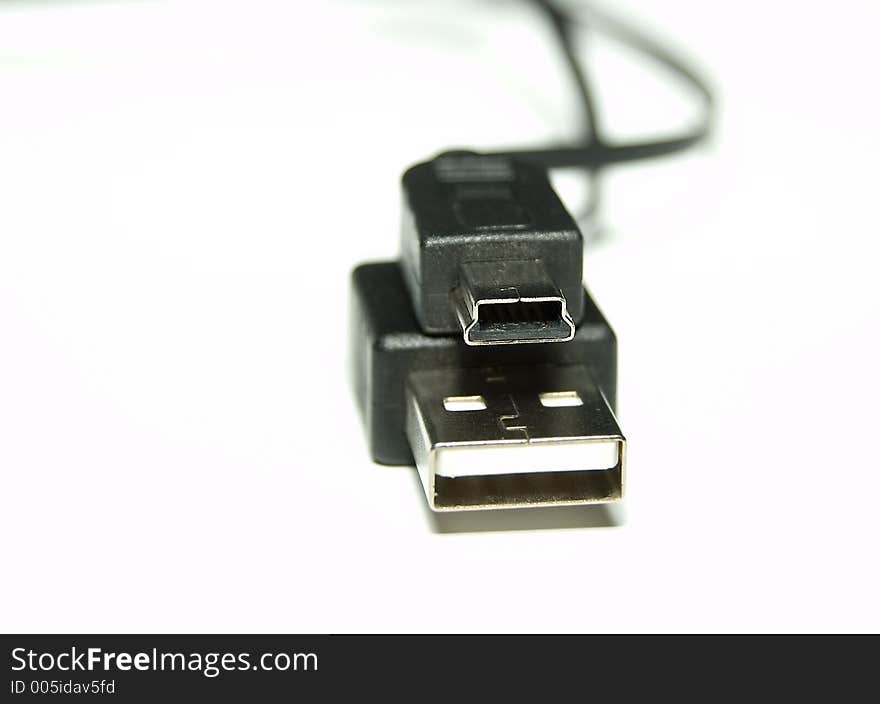 Black USB Cable over white background
Shallow Depth of field