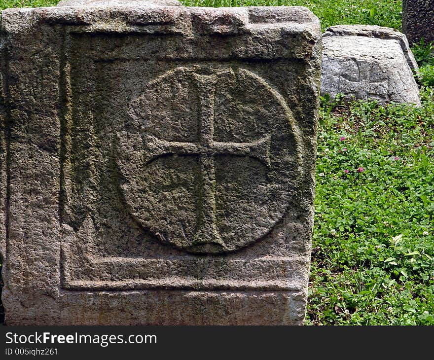 Cross relief on old stone.