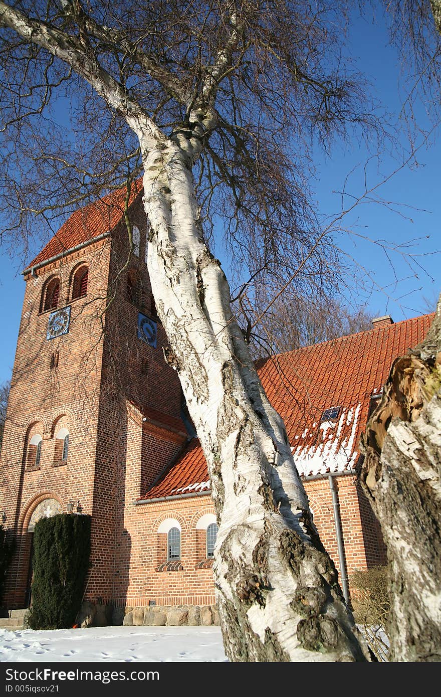 Small church in denmark in a forest in the winter