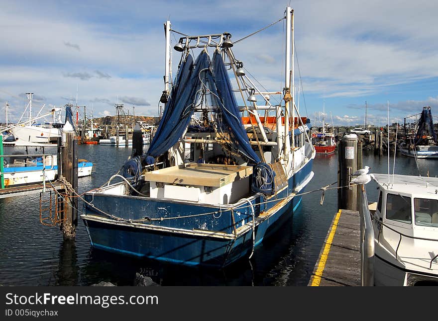 Fishing boat moored in a marina on the mid north coast of Australia