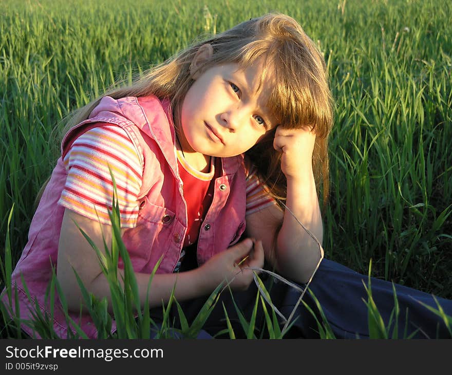 Babygirl in a green field