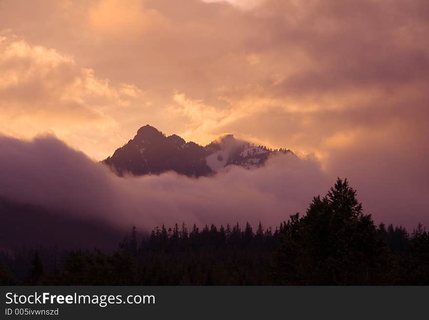 Cloudy mountaintops at sunrise. Cloudy mountaintops at sunrise