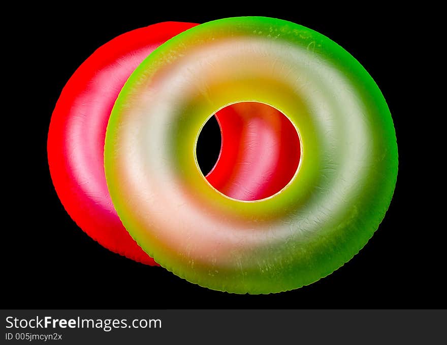 Pair of Inflatable Round Pool Tubes. Isolated on Black