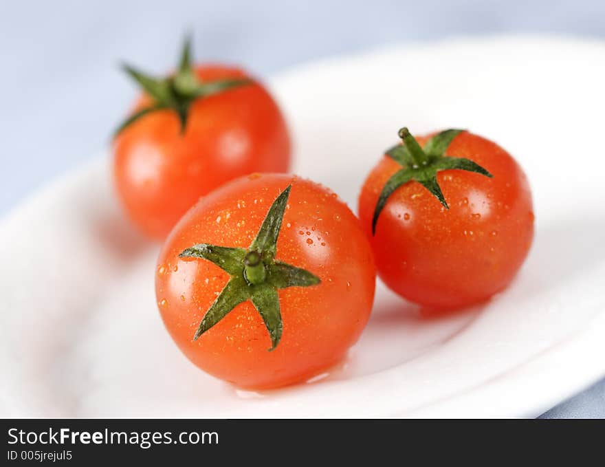 Fresh tomatoes with water droplets