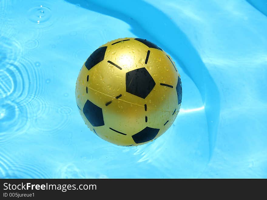 Yellow ball in the pool