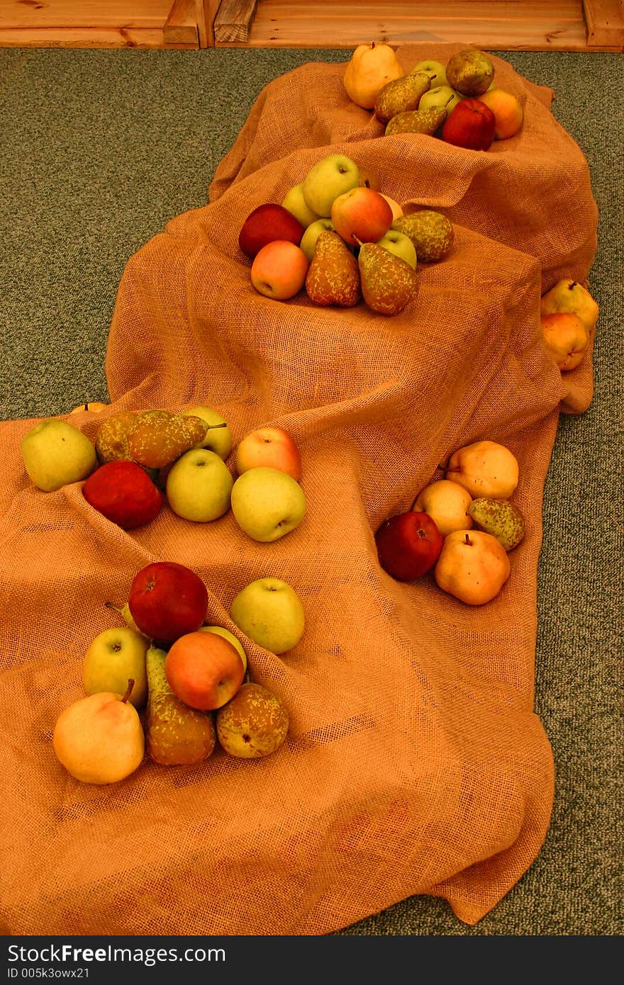 Apples, oranges and pears displayed over a sack. Apples, oranges and pears displayed over a sack