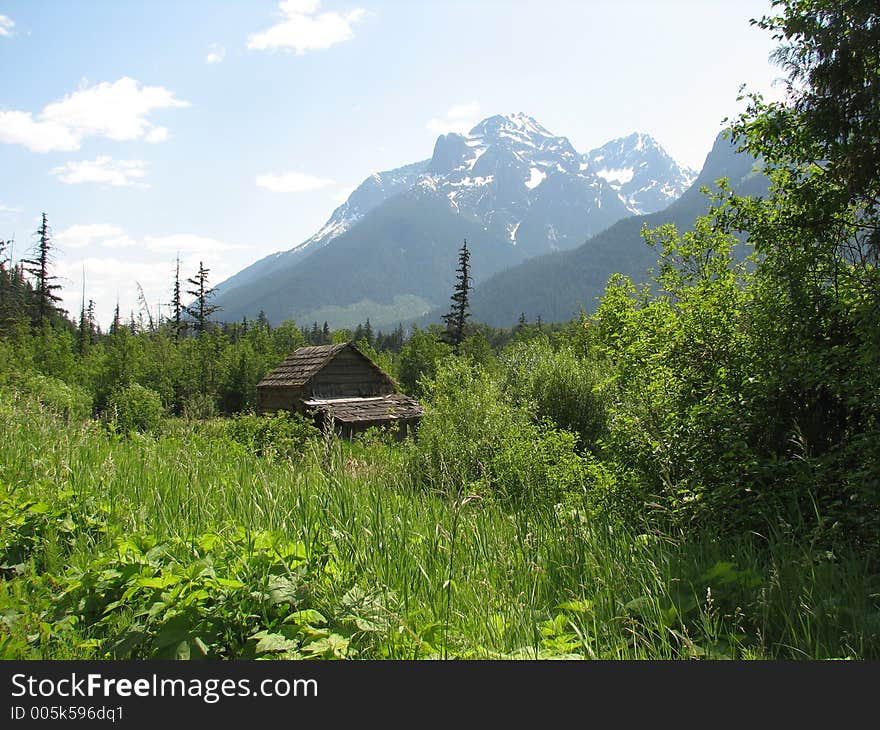 Old cabin and the mountains