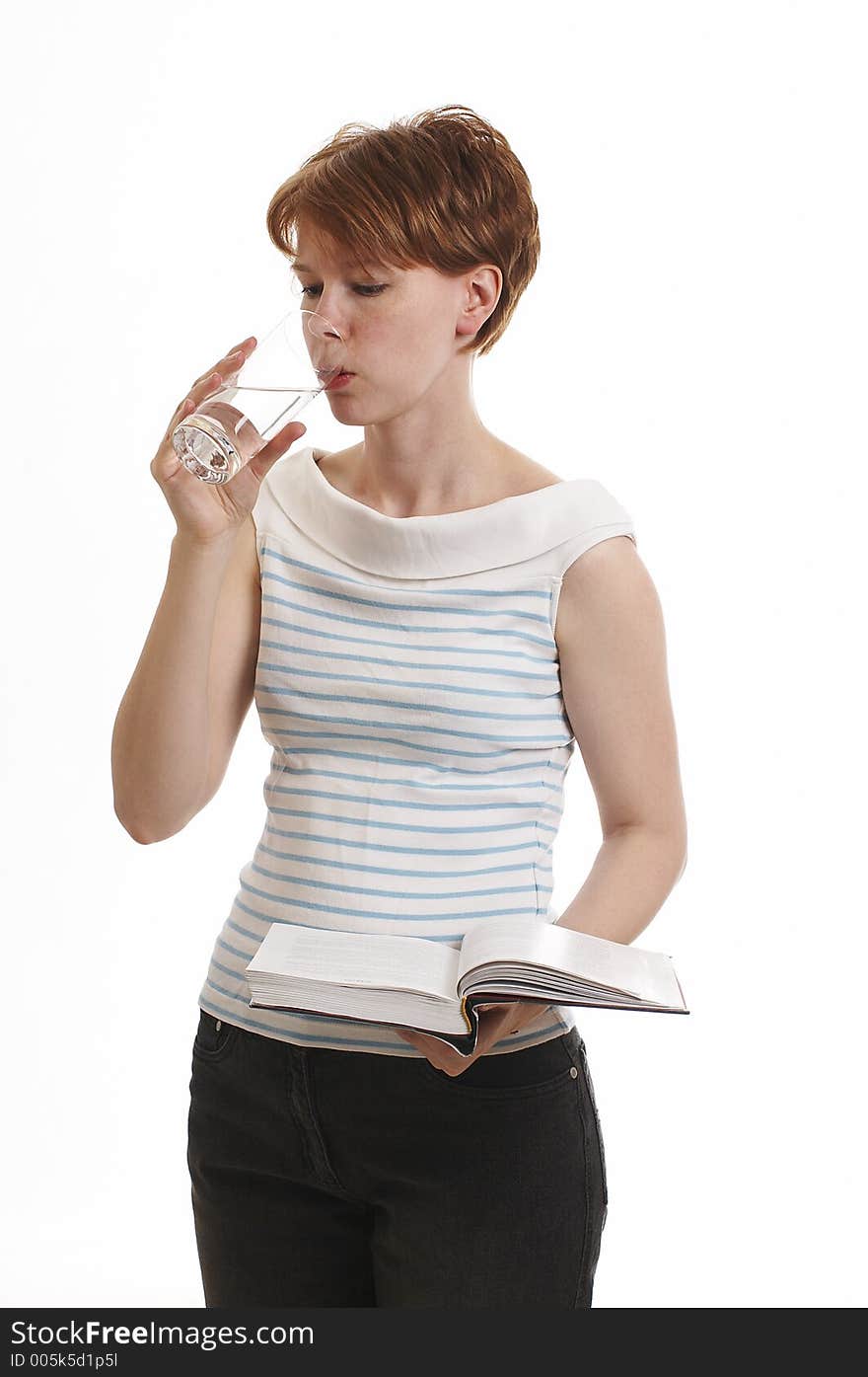 Girl holding the book and drinking water