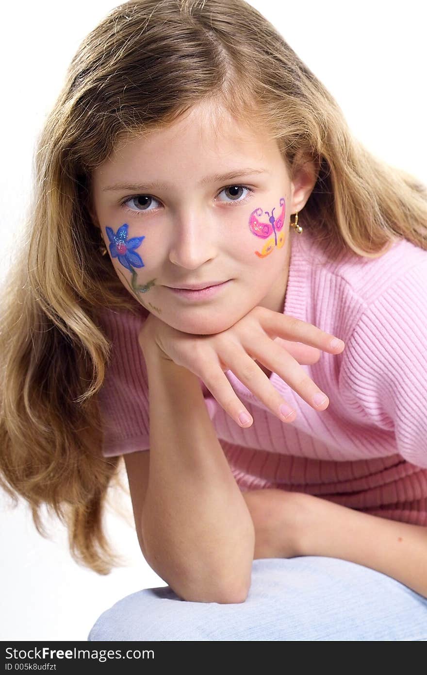 Beautiful young girl with a flower and butterfl drawing on her cheek. Beautiful young girl with a flower and butterfl drawing on her cheek