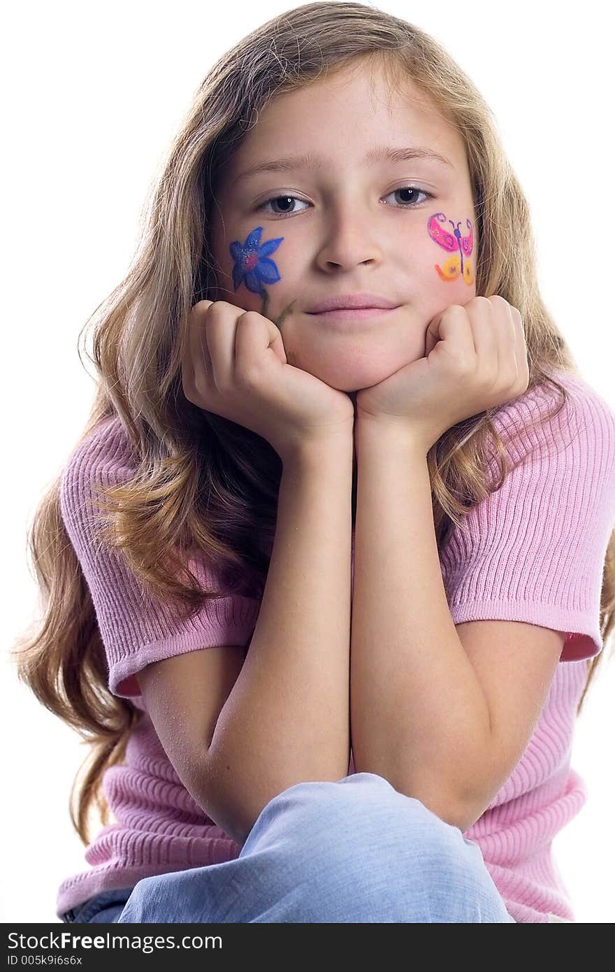 Beautiful young girl with a flower and butterfl drawing on her cheek. Beautiful young girl with a flower and butterfl drawing on her cheek