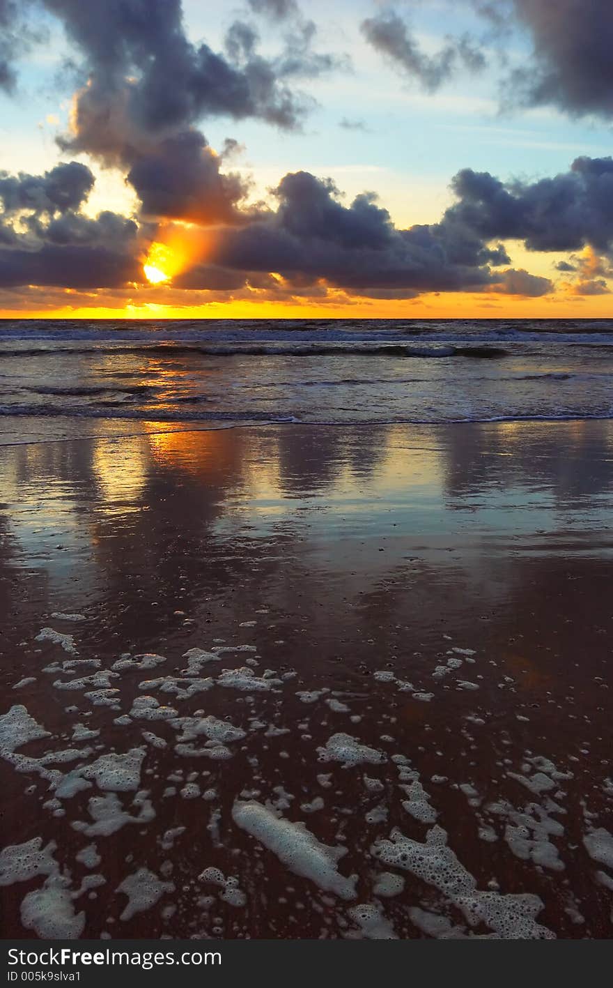 Sunset on a beach in the netherlands with golden colors. Sunset on a beach in the netherlands with golden colors