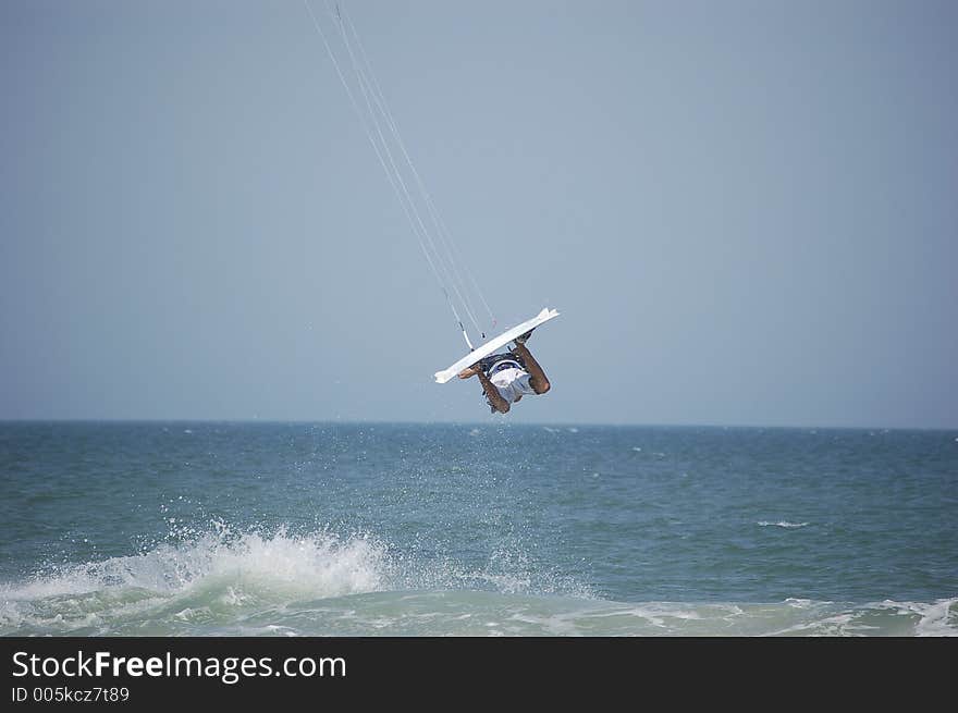 A kitesurfer gets fully airborne at Ponce Inlet Beach, Florida. A kitesurfer gets fully airborne at Ponce Inlet Beach, Florida