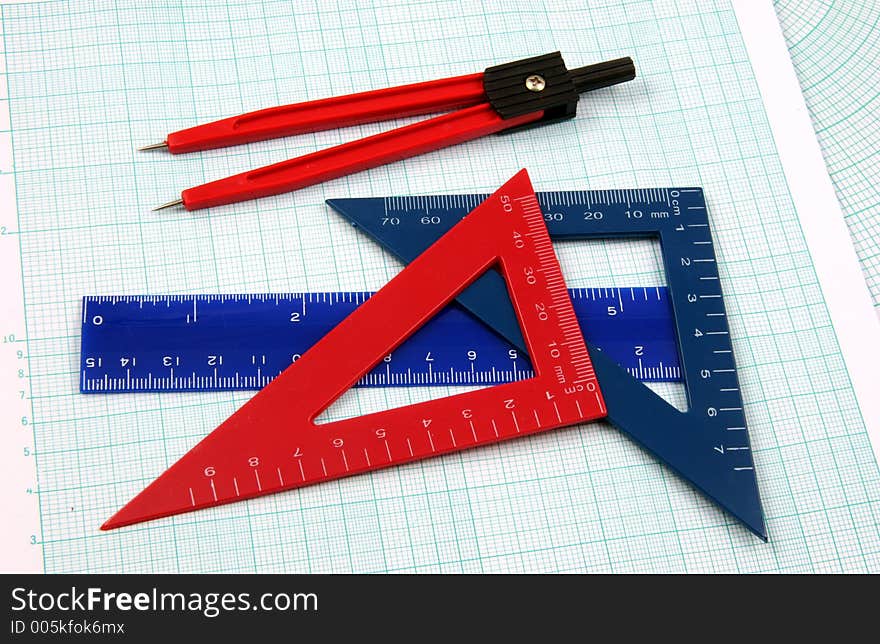 Geometric tools over a polar graphic paper. Geometric tools over a polar graphic paper