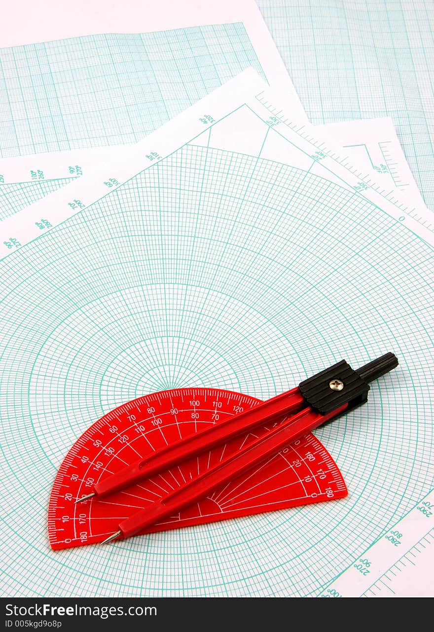 Red compass and degrees measure over a polar graphic paper. Red compass and degrees measure over a polar graphic paper