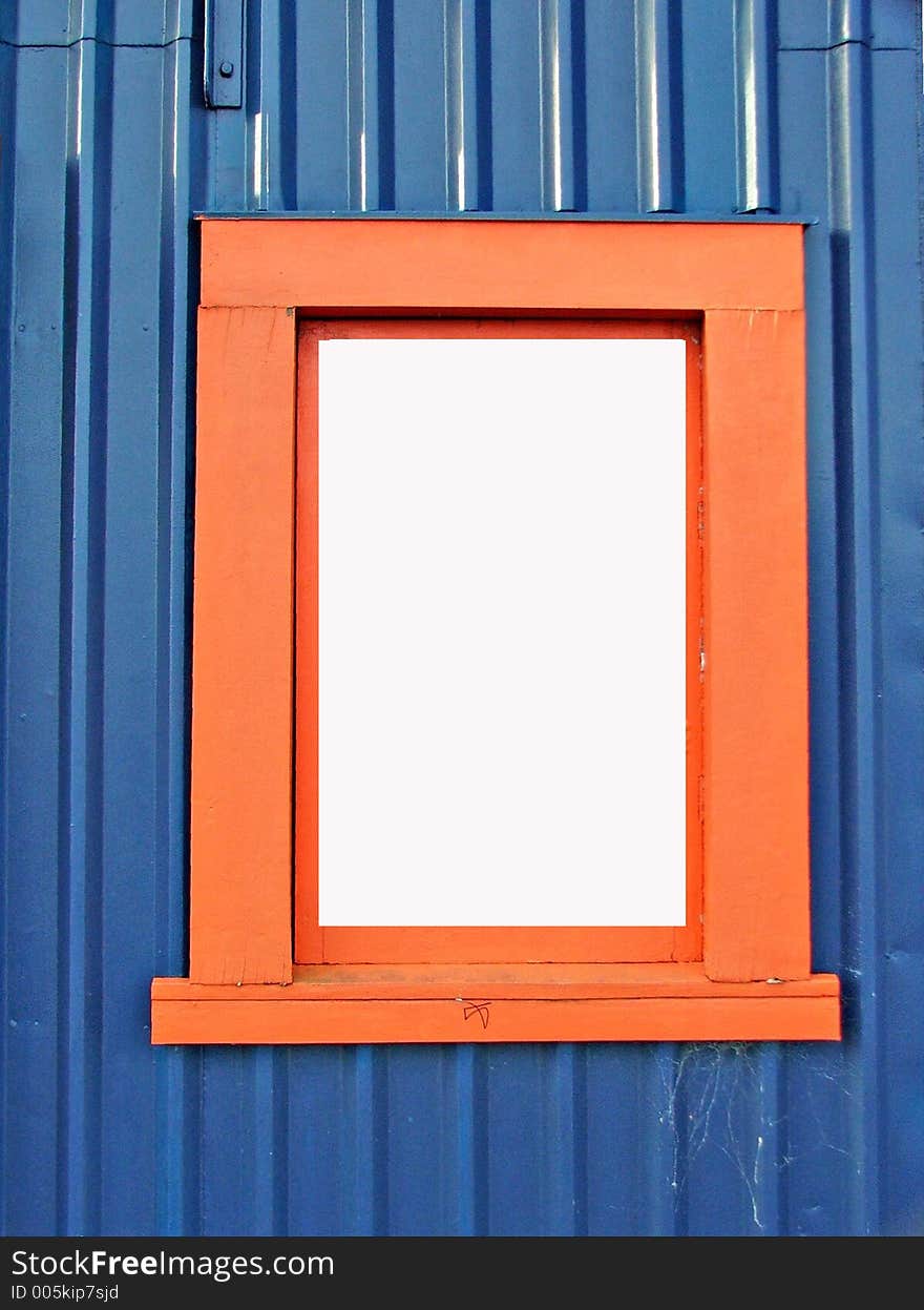 Orange window-frame against blue wall. Orange window-frame against blue wall