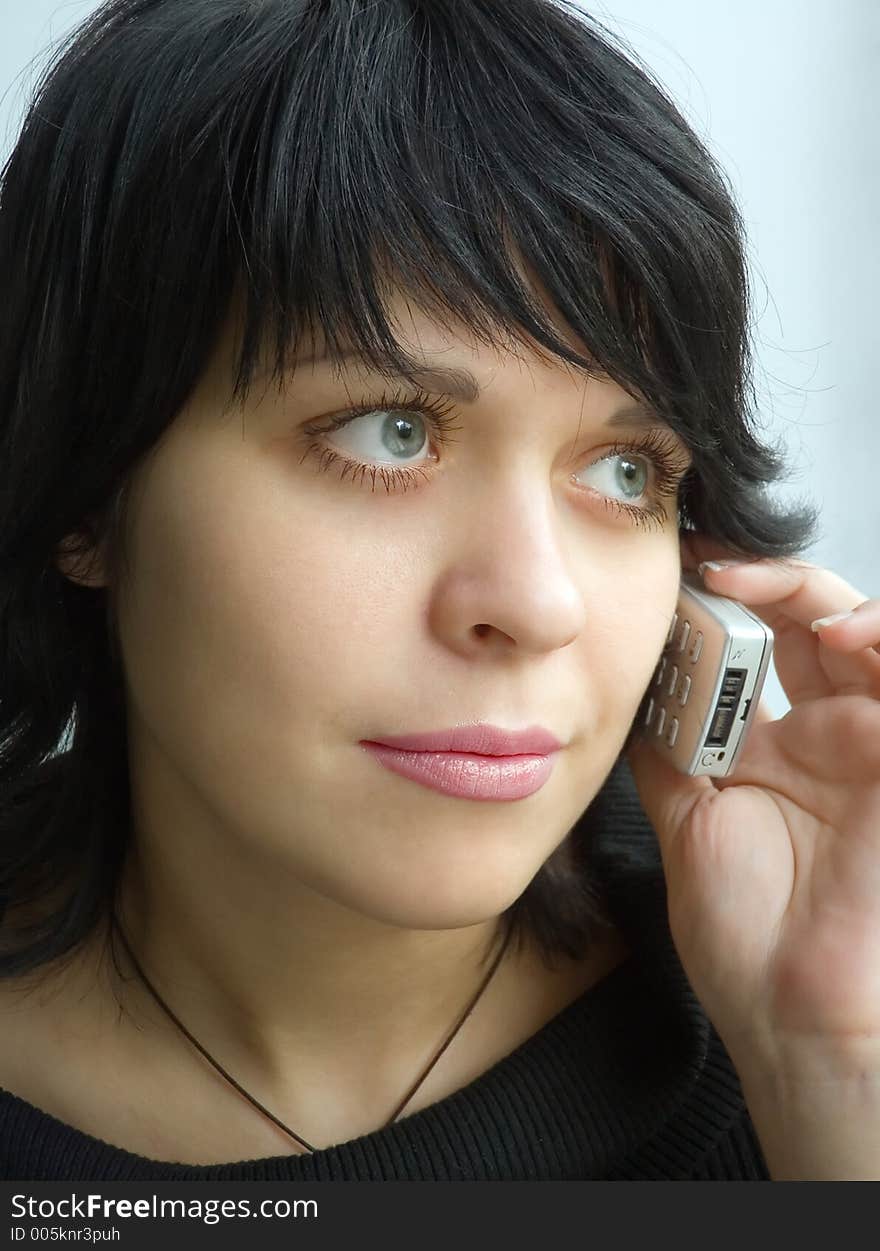 Beautiful girl speaks on telephone