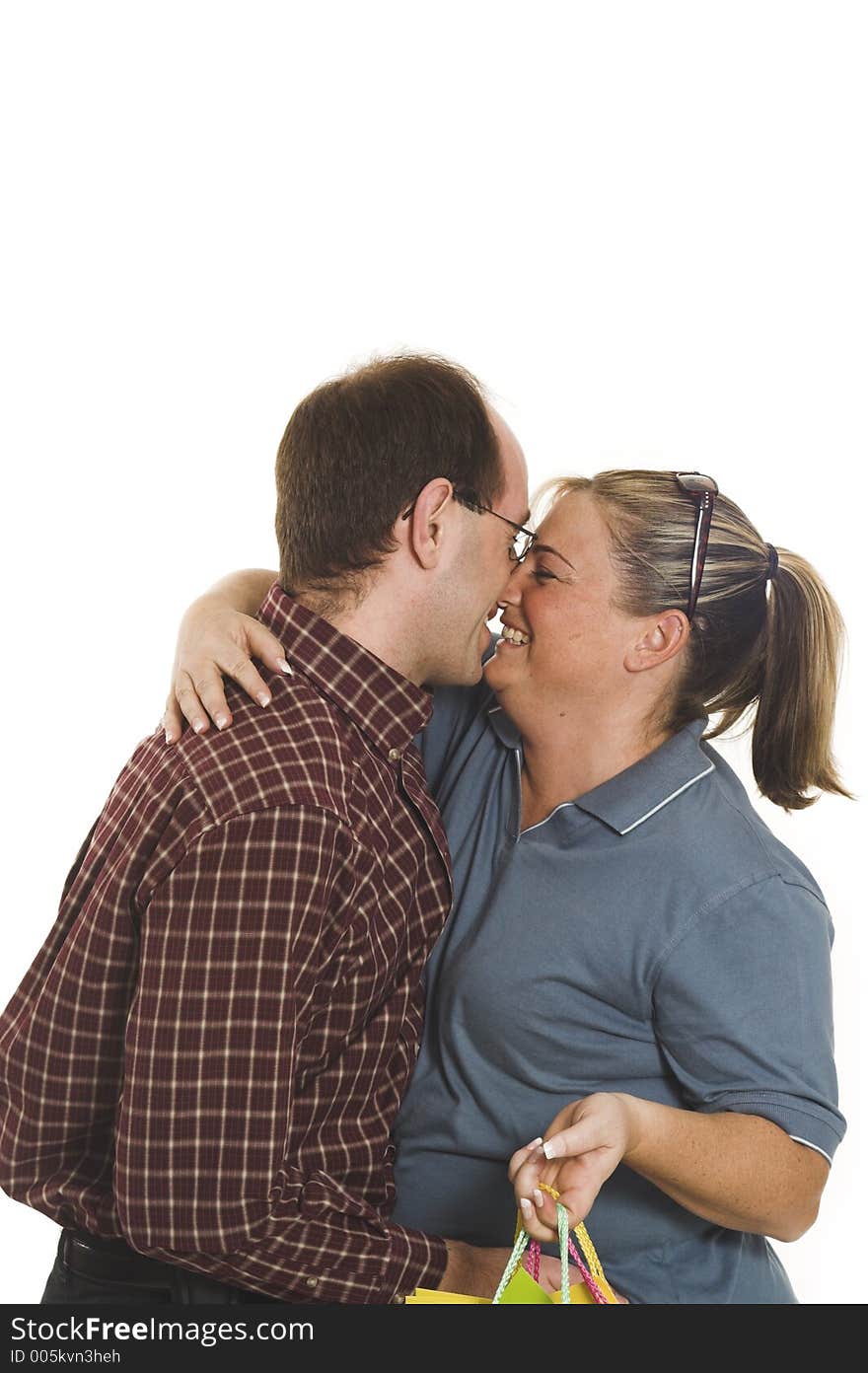 Couple kissing over white background