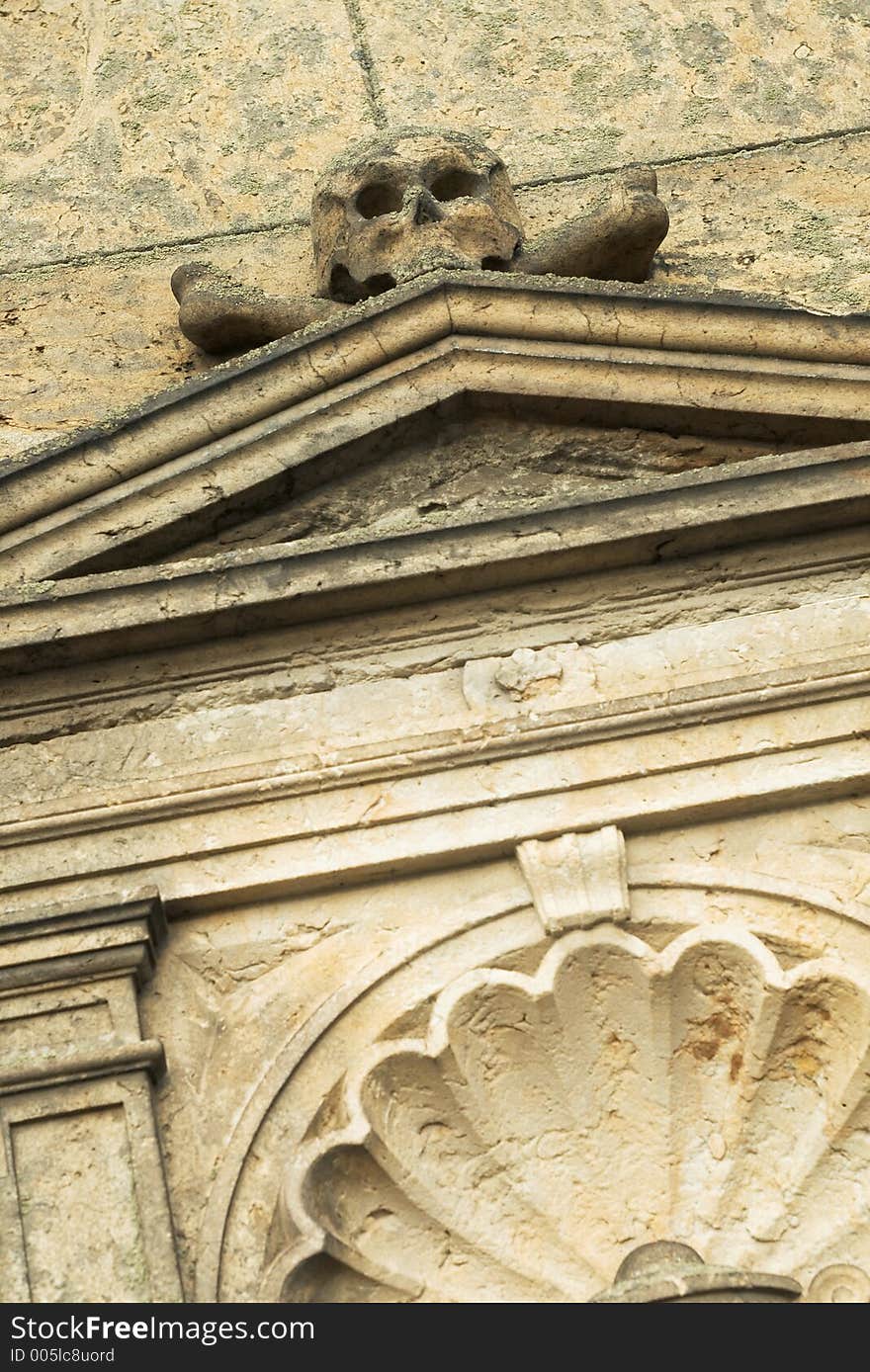 Sandstone crypt with skull