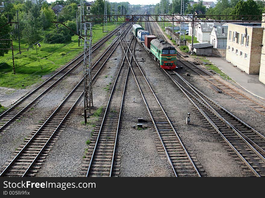 Flat railroad with coming train. Flat railroad with coming train