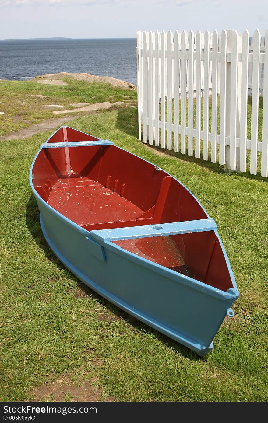 Green boat on the shore